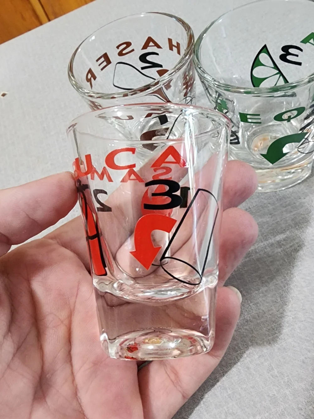Clear Glass Shot Glasses with Multicolor Icons - Set of 4